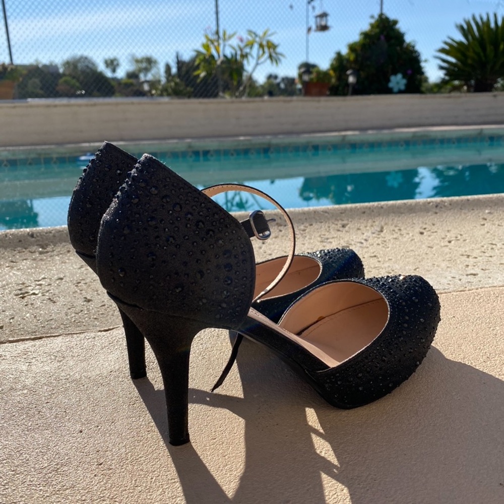 Women’s Black Strap Heels and Black Clutch Purse